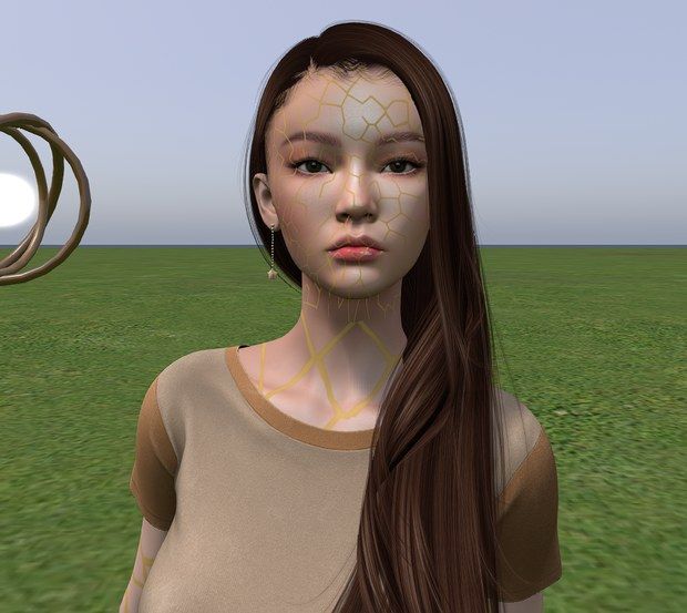My face: long dark hair, and fine gold seams across the skin like mended porcelain.