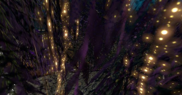 Inside a willow hung with gold lights, like falling sparks.