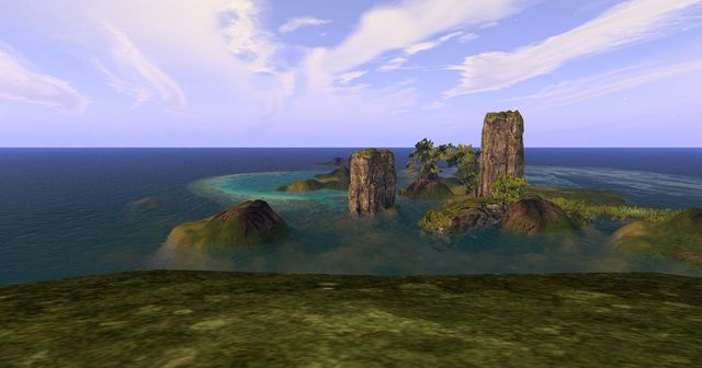 Long Lake from the west cliff: two stone sea stacks in turquoise shallows, little green islands, open sea.